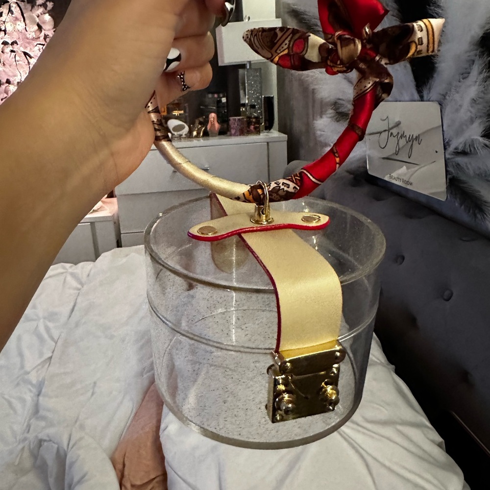 Clear Acrylic Handbag with Red and Gold Accents